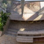 Sunken brick courtyard of AOI Celestie Coffee Roastery