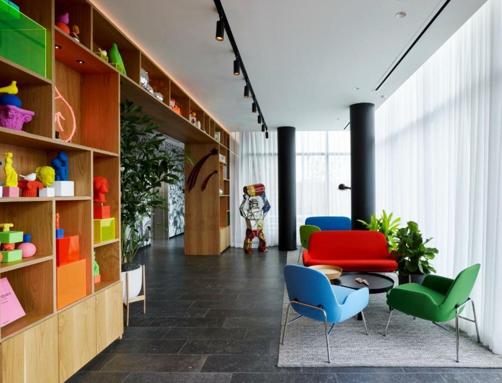 Colourful display shelf and Vitra chairs at citizenM Washington DC Capitol