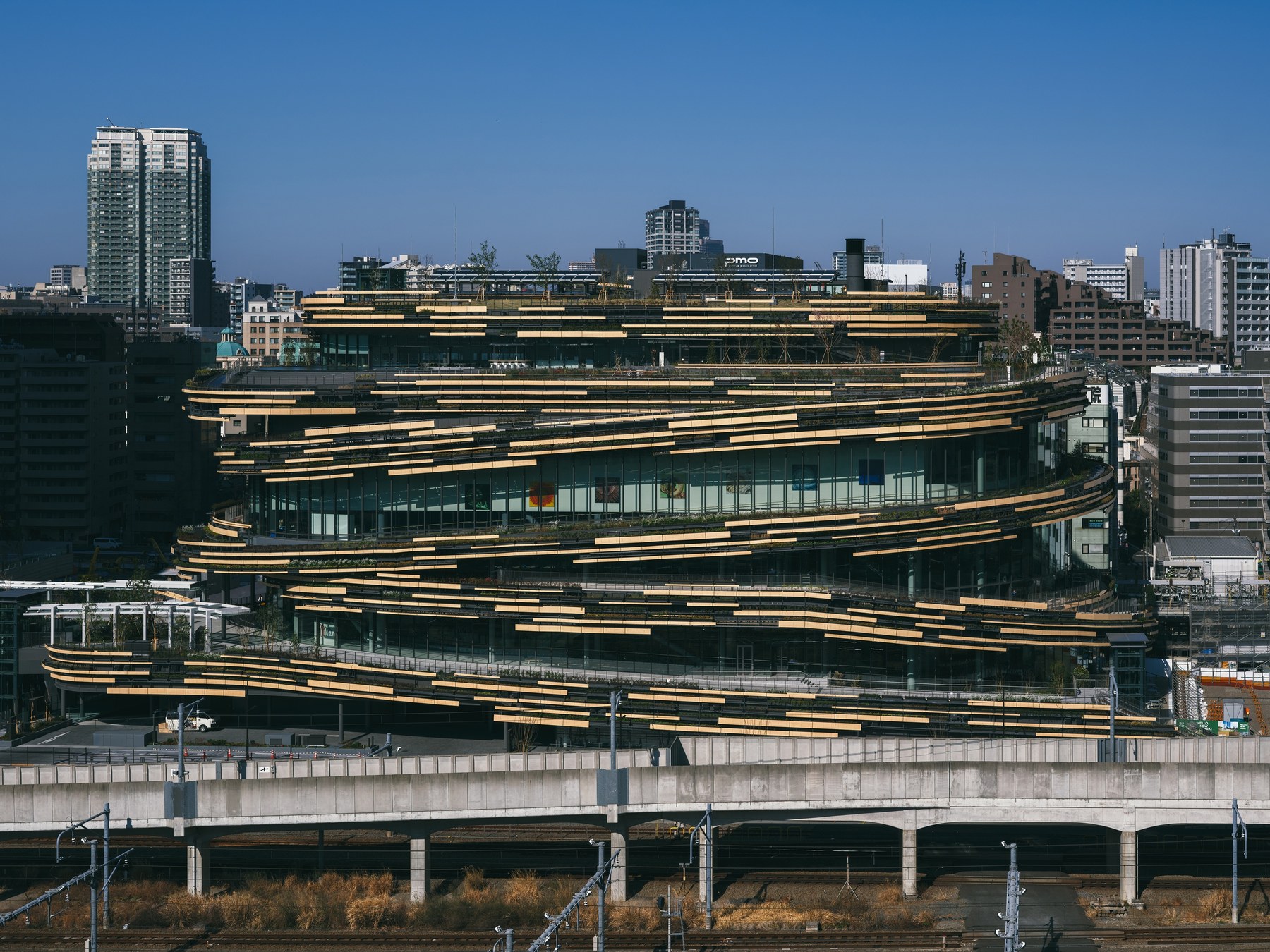 MoN Takanawa seen across the railway tracks