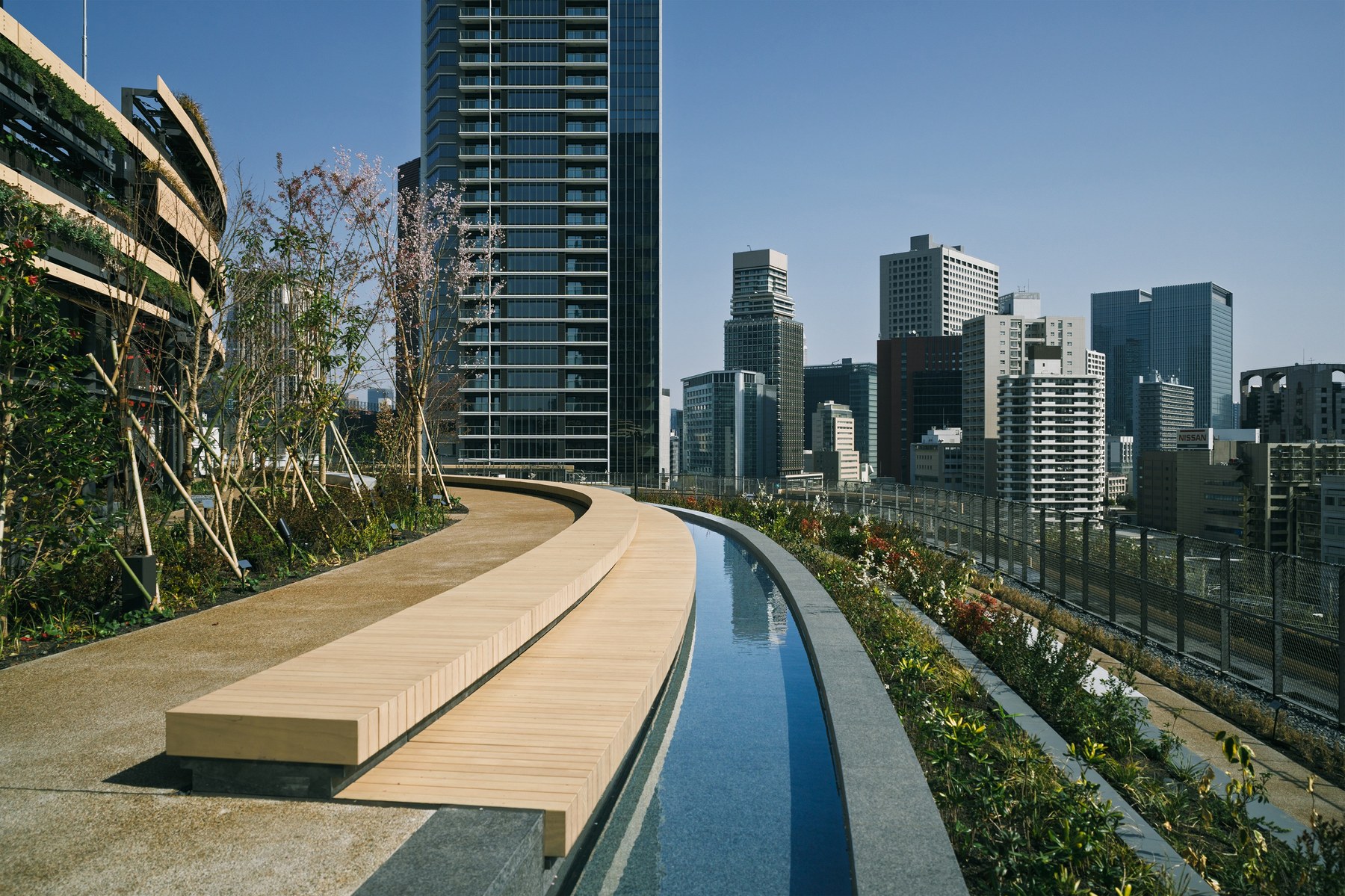 Rooftop terrace and water channel at MoN Takanawa